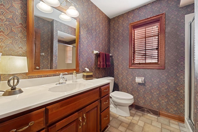 bathroom with wallpapered walls, toilet, visible vents, and a stall shower