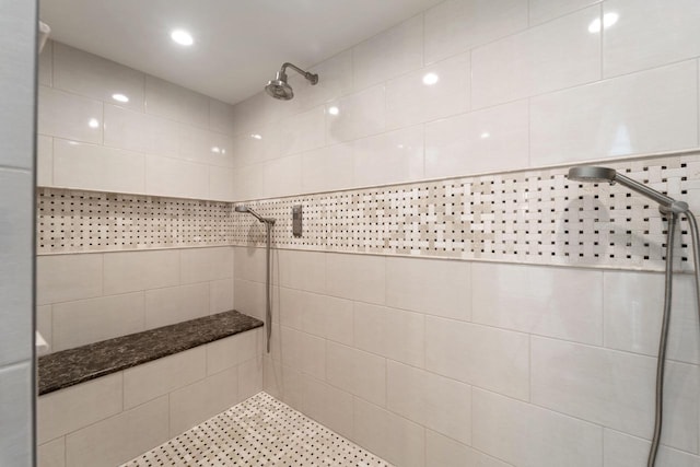 bathroom featuring a tile shower