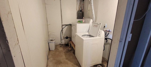 washroom featuring electric panel and washing machine and dryer