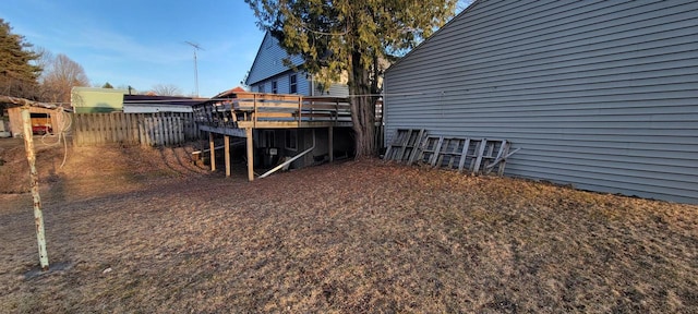 view of yard featuring a deck and fence