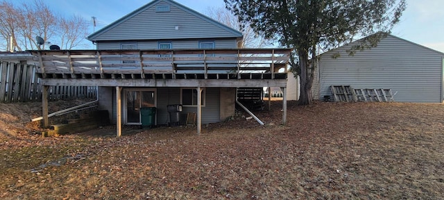 back of house featuring a deck