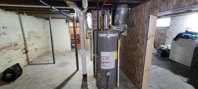 utility room featuring washer / dryer and gas water heater