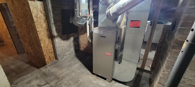 utility room with heating unit