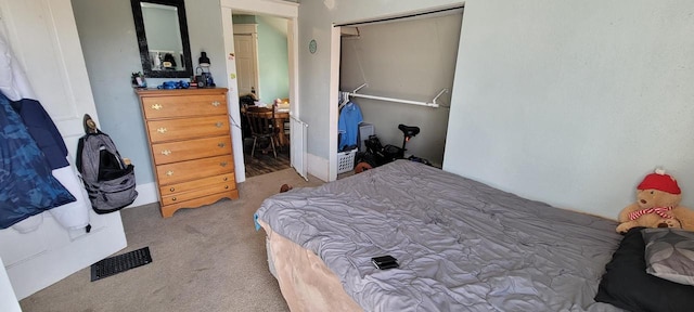 carpeted bedroom with a closet and visible vents