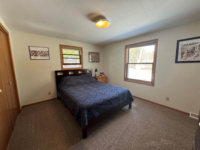 bedroom featuring baseboards and carpet floors