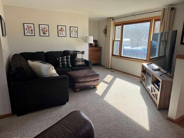 living room with light colored carpet and baseboards