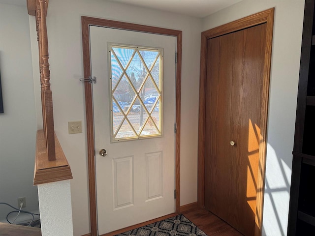 foyer featuring wood finished floors