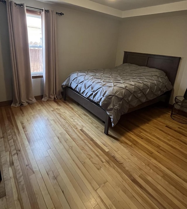 bedroom featuring light wood-style flooring