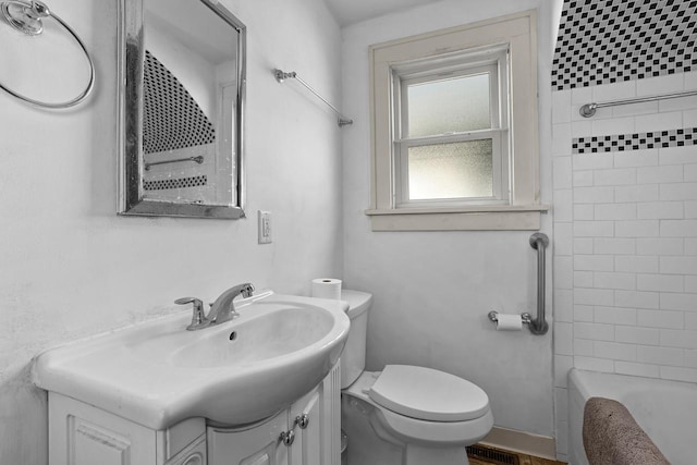 bathroom with toilet and vanity