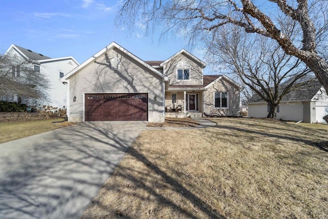 view of front facade with a front yard, a garage, and driveway