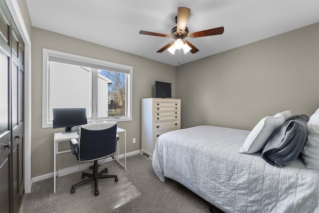 carpeted bedroom featuring baseboards, a closet, and ceiling fan