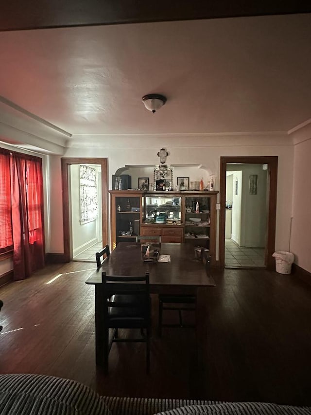 dining space with wood finished floors