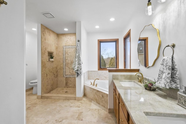 bathroom with toilet, double vanity, tiled shower, a bath, and a sink