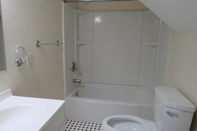 bathroom featuring bathtub / shower combination, toilet, and vanity