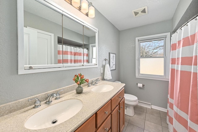 full bathroom with a sink, visible vents, toilet, and double vanity