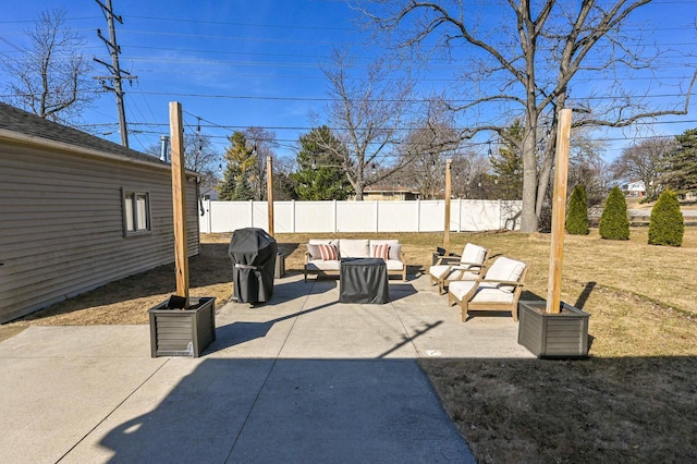 view of patio with an outdoor living space, a grill, and a fenced backyard