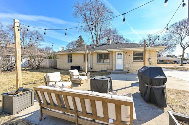 back of property with an outdoor living space, a patio, fence, brick siding, and a chimney