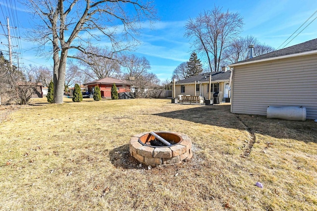 view of yard featuring a fire pit