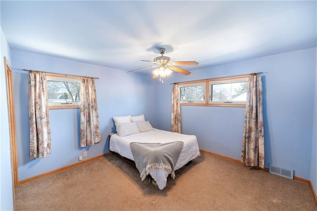 bedroom featuring visible vents, carpet, and baseboards