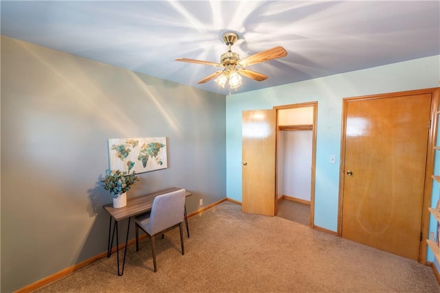 office with carpet flooring, baseboards, and a ceiling fan