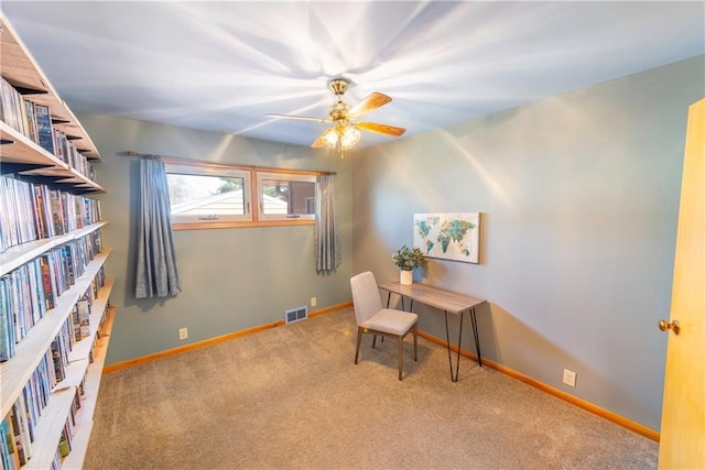 home office with visible vents, baseboards, a ceiling fan, and carpet floors