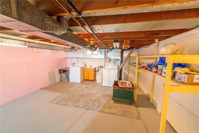 basement with washing machine and clothes dryer