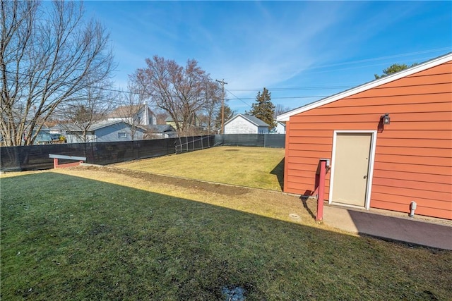 view of yard with an outdoor structure and a fenced backyard