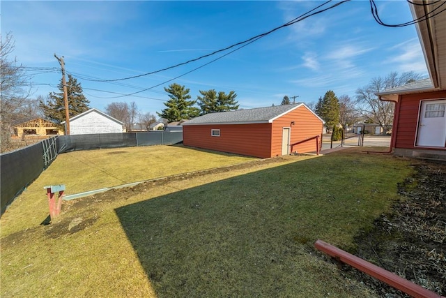 view of yard with an outdoor structure and a fenced backyard