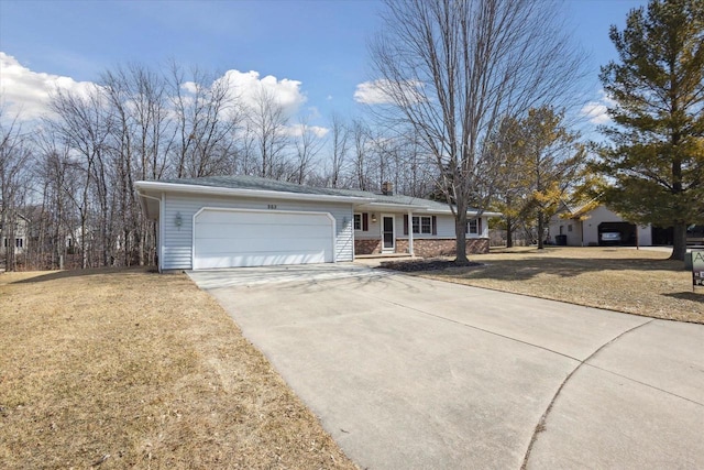 single story home featuring a garage, driveway, and a front yard