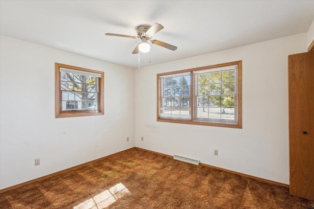 unfurnished room with carpet flooring, visible vents, baseboards, and ceiling fan