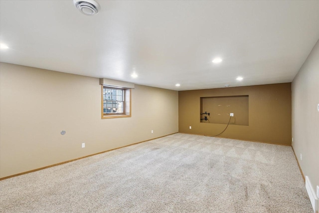 below grade area with recessed lighting, baseboards, and carpet flooring