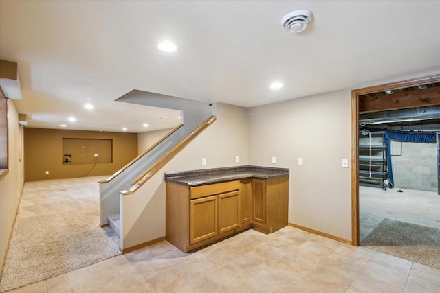 bar featuring light carpet, recessed lighting, stairs, and baseboards