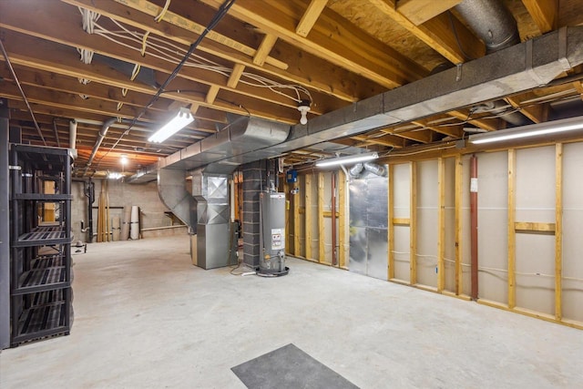 unfinished basement with gas water heater and heating unit