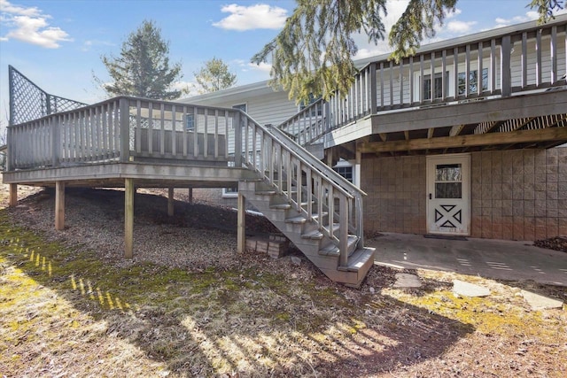 back of property with stairway and a deck