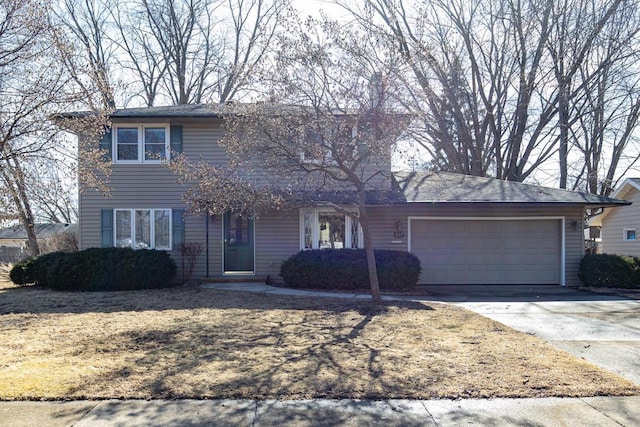 traditional home featuring a garage and driveway