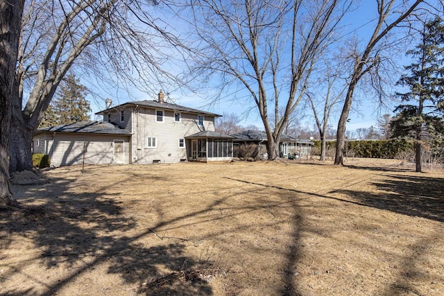 view of yard featuring a sunroom