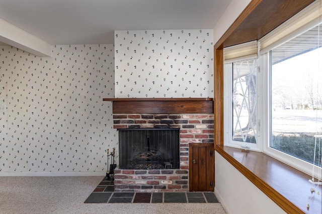 interior details featuring wallpapered walls, a fireplace, baseboards, and carpet floors