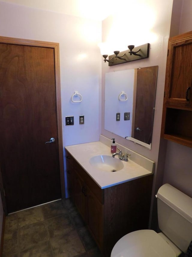 half bathroom with toilet and vanity