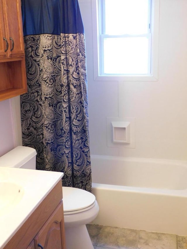 bathroom with tile patterned flooring, shower / bath combination with curtain, toilet, and vanity