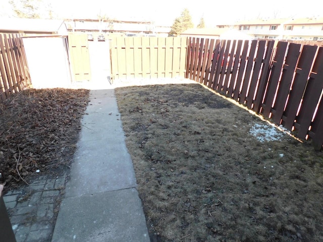 view of yard with a fenced backyard