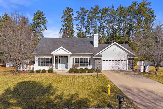 view of front of home with a front yard, fence, driveway, a chimney, and a garage