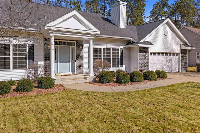 view of front of property with a front lawn, roof with shingles, concrete driveway, a garage, and a chimney