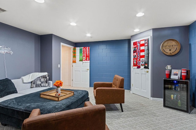 living room featuring wine cooler, visible vents, recessed lighting, and carpet