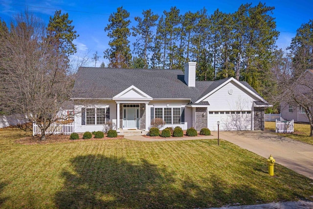 view of front of property featuring concrete driveway, a garage, a front yard, and a chimney