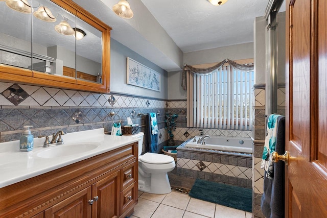 full bath featuring a garden tub, toilet, tile walls, tile patterned flooring, and vanity