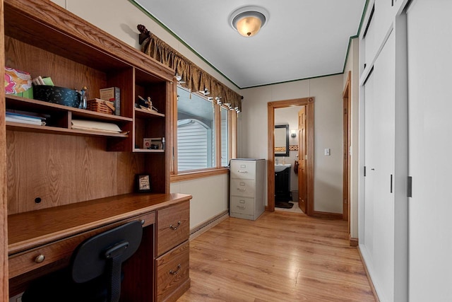 office with baseboards and light wood-style floors