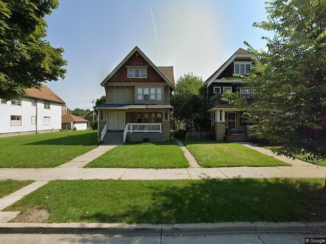 view of front of home featuring a porch and a front lawn