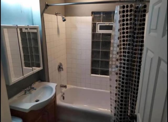 bathroom featuring vanity and shower / tub combo