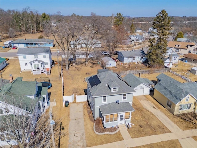 birds eye view of property with a residential view