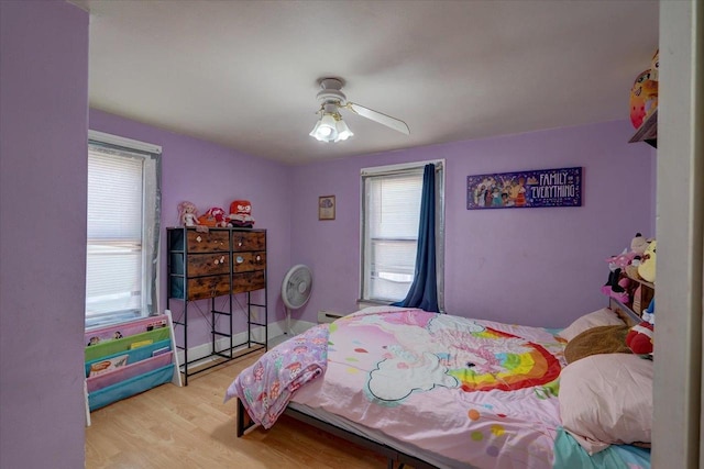 bedroom featuring ceiling fan and wood finished floors